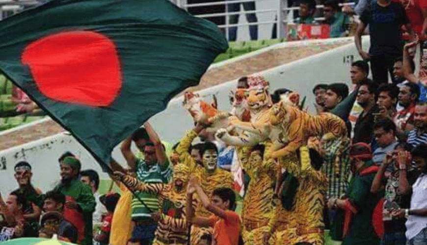 Bangladesh cricket fans celebrating and cheering for their team in the stadium