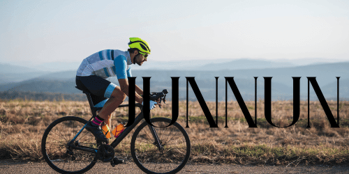 Person riding a bicycle outdoors during a cycling journey