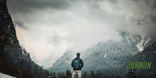 Traveler walking with a backpack while exploring a scenic destination