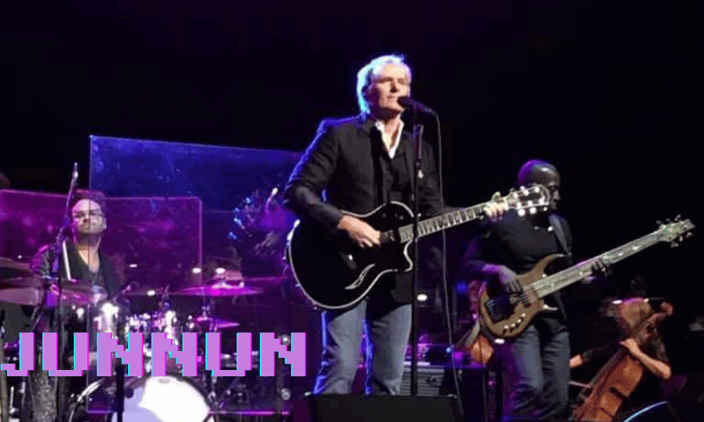 Michael Bolton singing passionately on stage during a live concert
